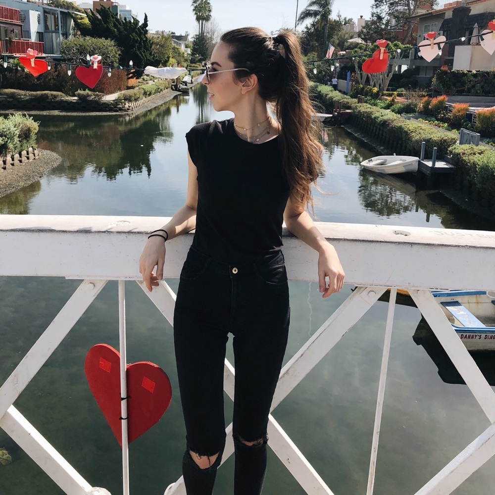 H&M black skinny jeans with busted knees